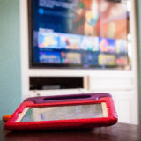 iPads and TV set up with educational toddler hows to have high quality screen time.